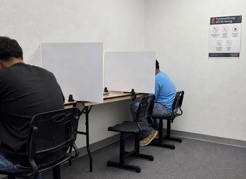 Candidates taking a proctored NCCER assessment in the on-site testing room