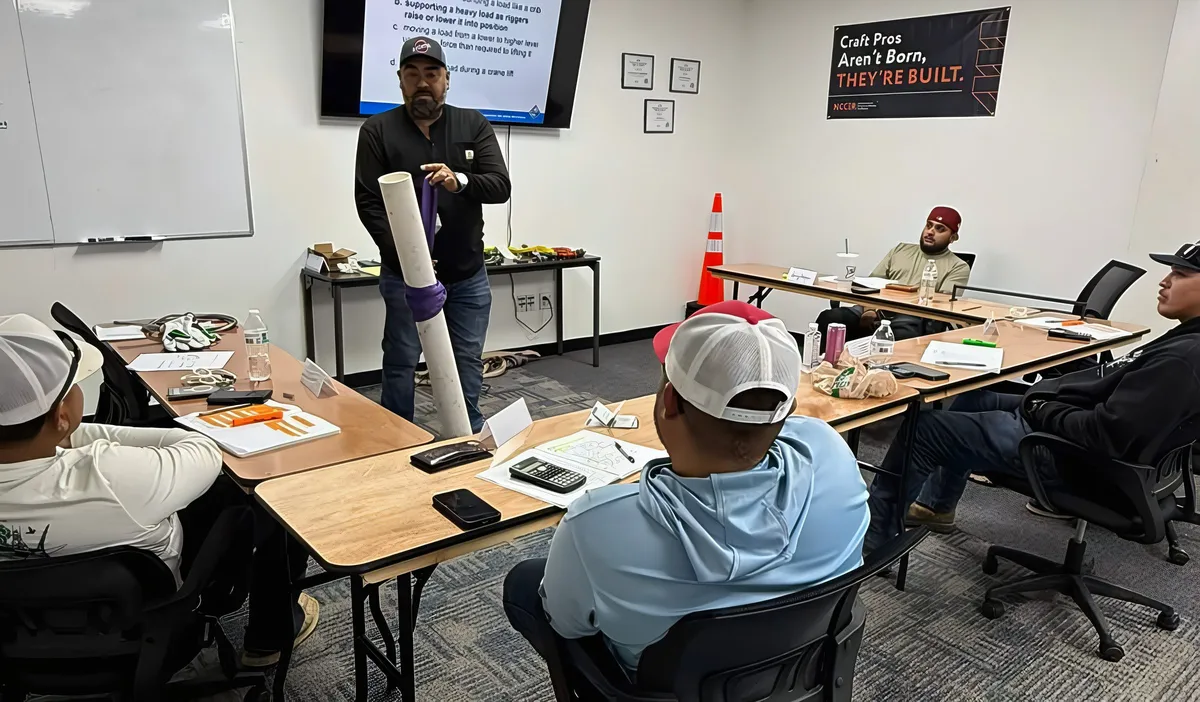 Instructor demonstrating a sling hitch on a load during an Advanced Rigger class
