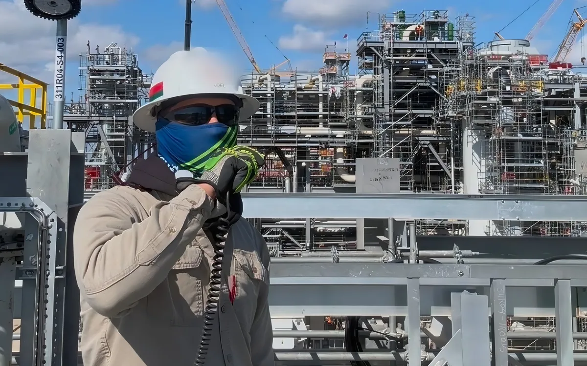 Signal person on the radio at a refinery jobsite