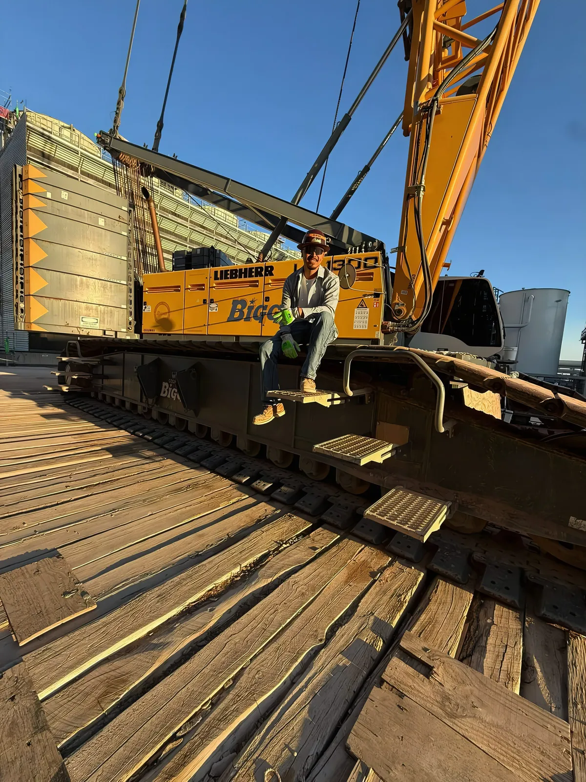 Juan Meza on the tracks of a Liebherr crawler crane at a jobsite