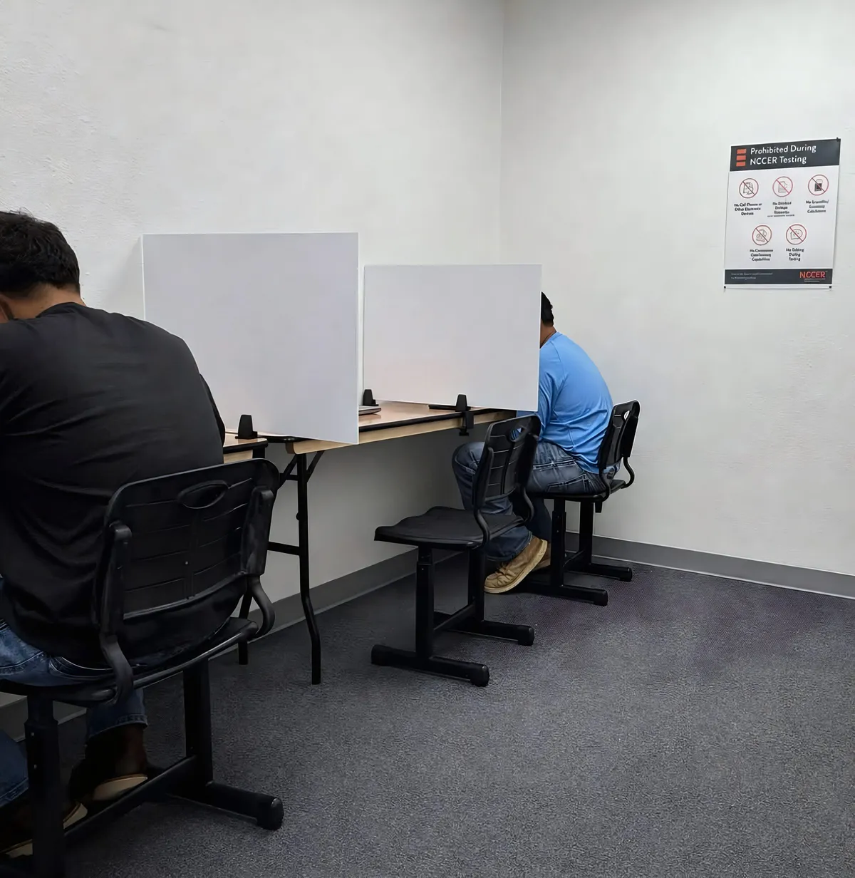 Candidates taking a proctored NCCER assessment in the on-site testing room